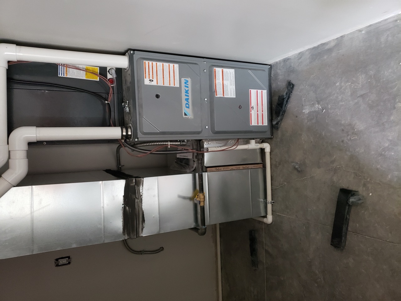 Daikin furnace and matched air handler in a clean garage installation