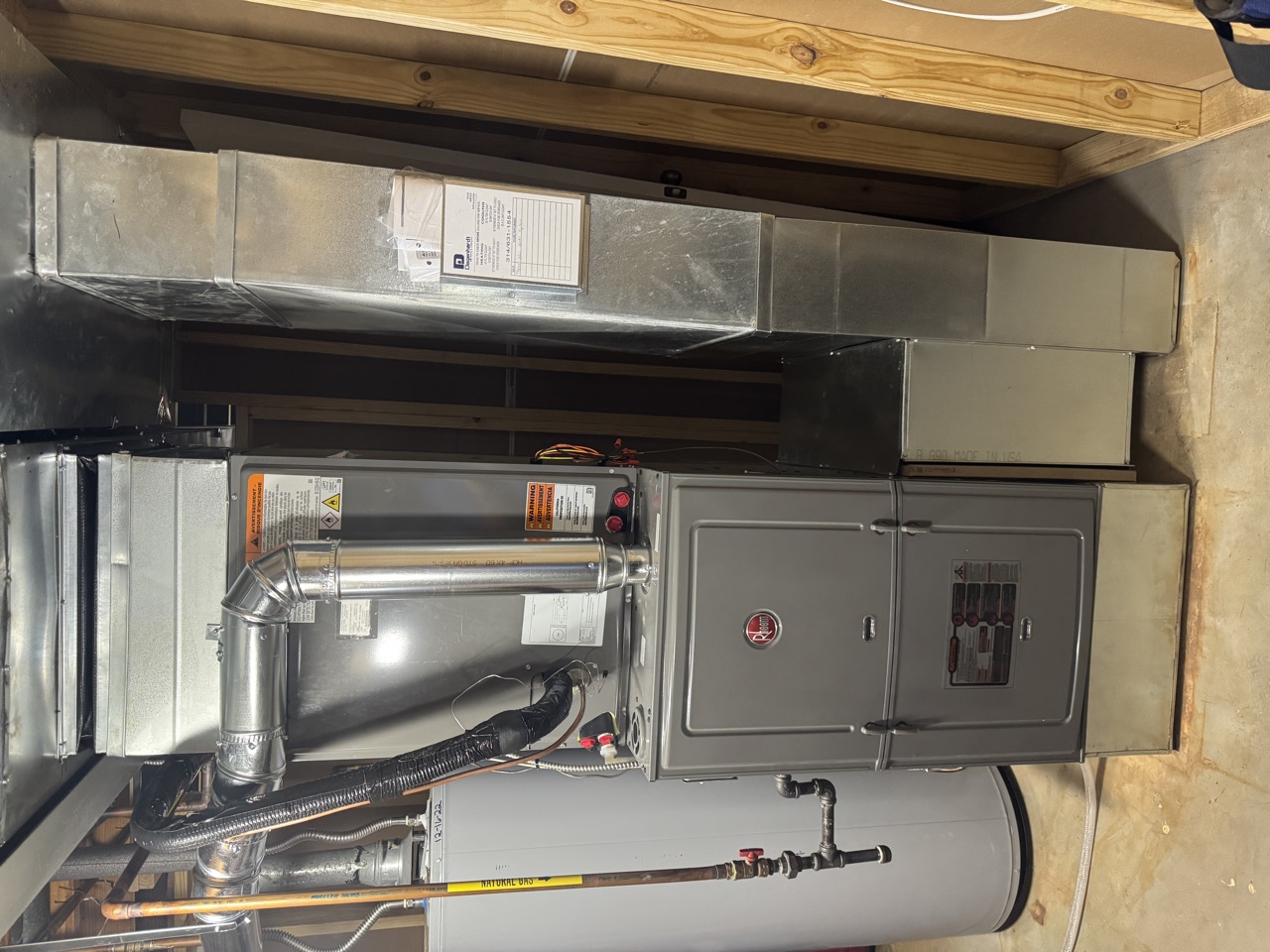 Rheem high-efficiency gas furnace installed in a St. Louis basement