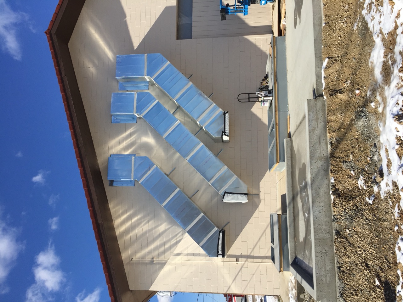 Custom sheet metal ductwork fabricated and installed by the Degenhardt crew on a commercial building