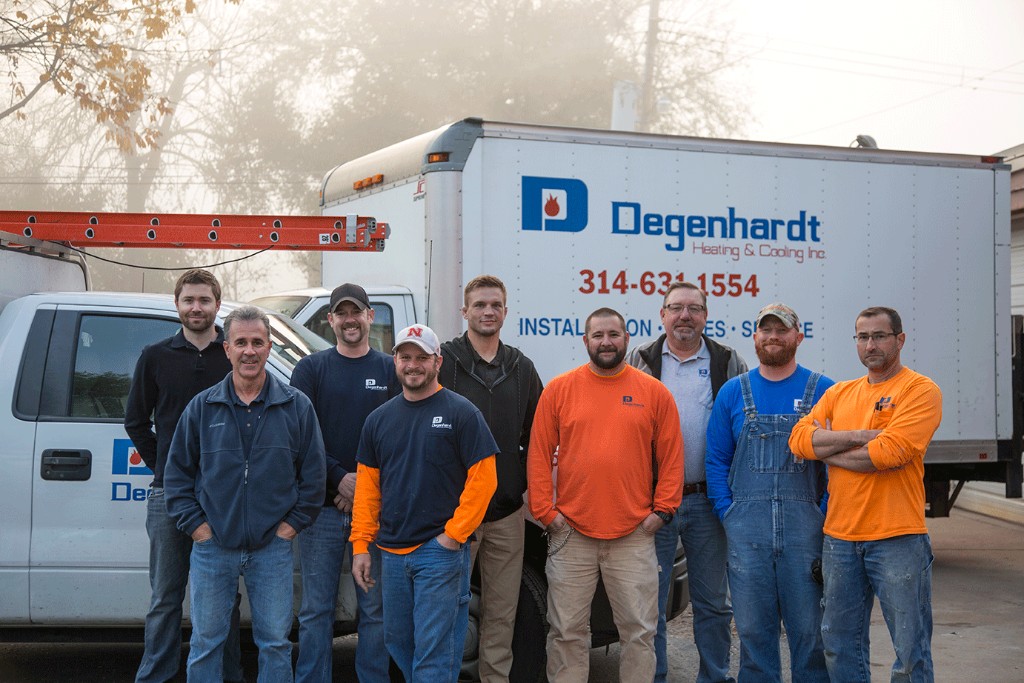 The Degenhardt Heating and Cooling crew standing with a branded service truck in South St. Louis